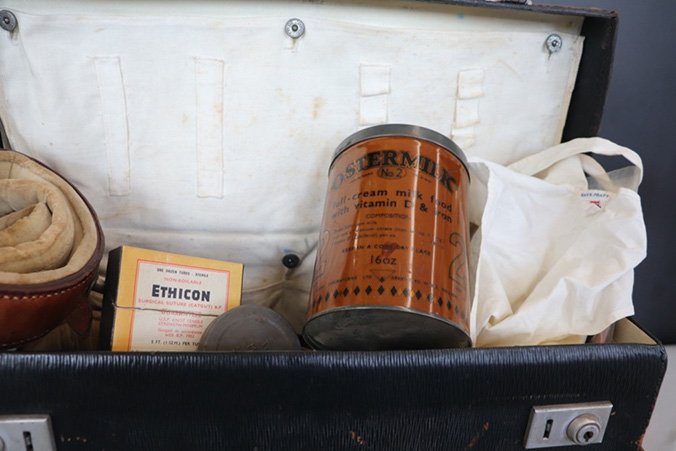An image of an open obstetrics bag to show an assortment of medical items used by a general practitioner. 