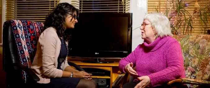 A doctor talking to an older patient