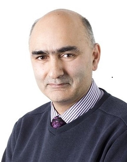 A head and shoulders photo of Dr Imran Rafi wearing a navy jumper over a shirt and tie. 