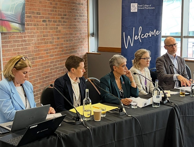 RCGP Chair Kamila Hawthorne sits in the middle of a seated panel at an event.