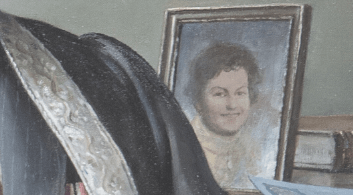 A close-up portion of an oil painting depicting a photo of a child in a frame.