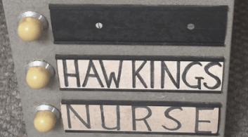 'Hawkings' and 'nurse' are handwritten next to buzzers mounted to a wall. 