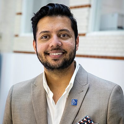 Headshot of Dr Akram Hussain.